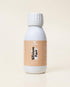 Flacon blanc de complément alimentaire liquide Silicium Fort Be Healthy, étiquette beige, posé sur fond crème uni